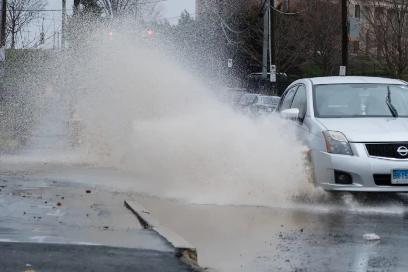 Flooding in North Hartford pooled in front of homes on Garden Street on Monday.